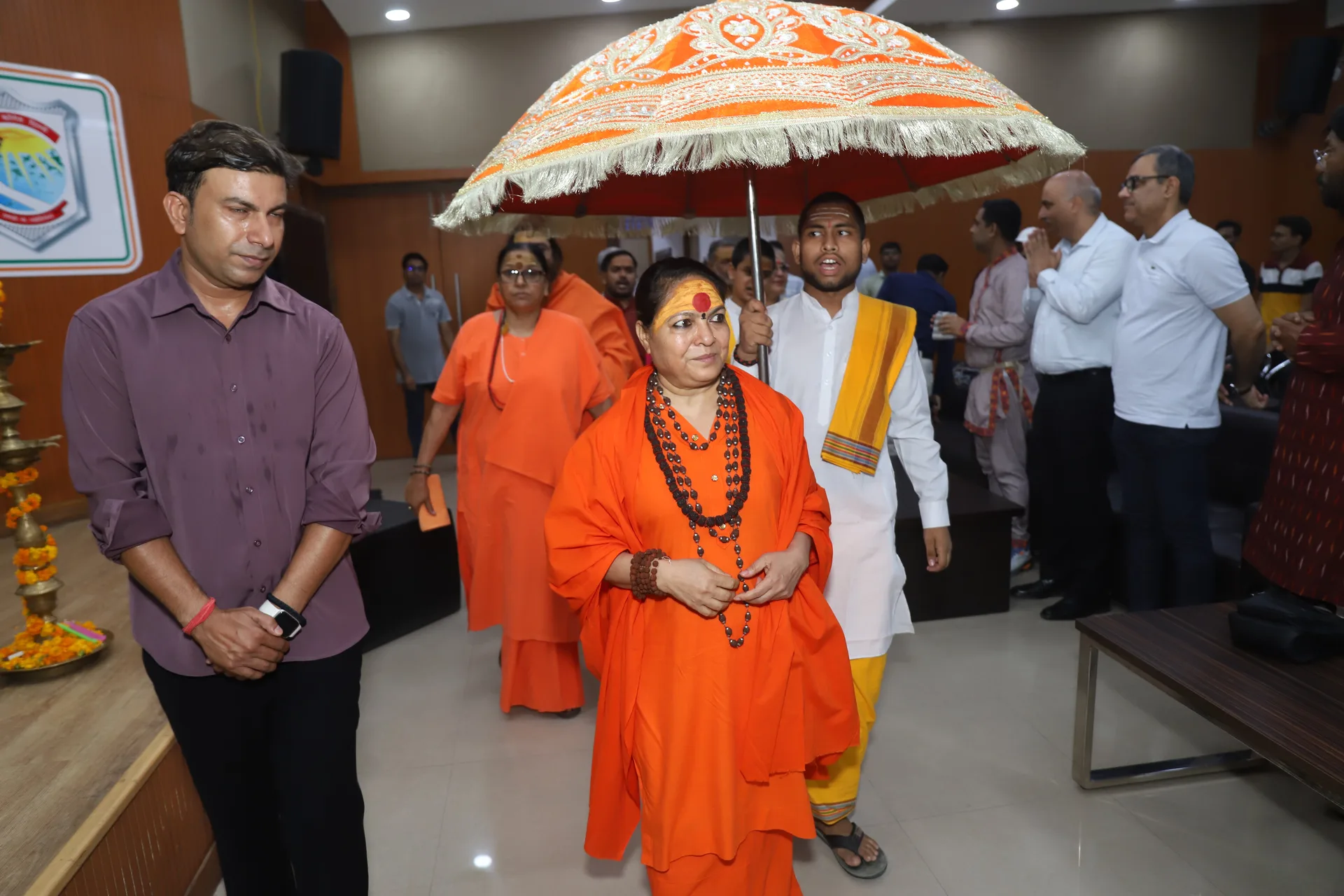 Saints arrive under the ceremonial chhatra