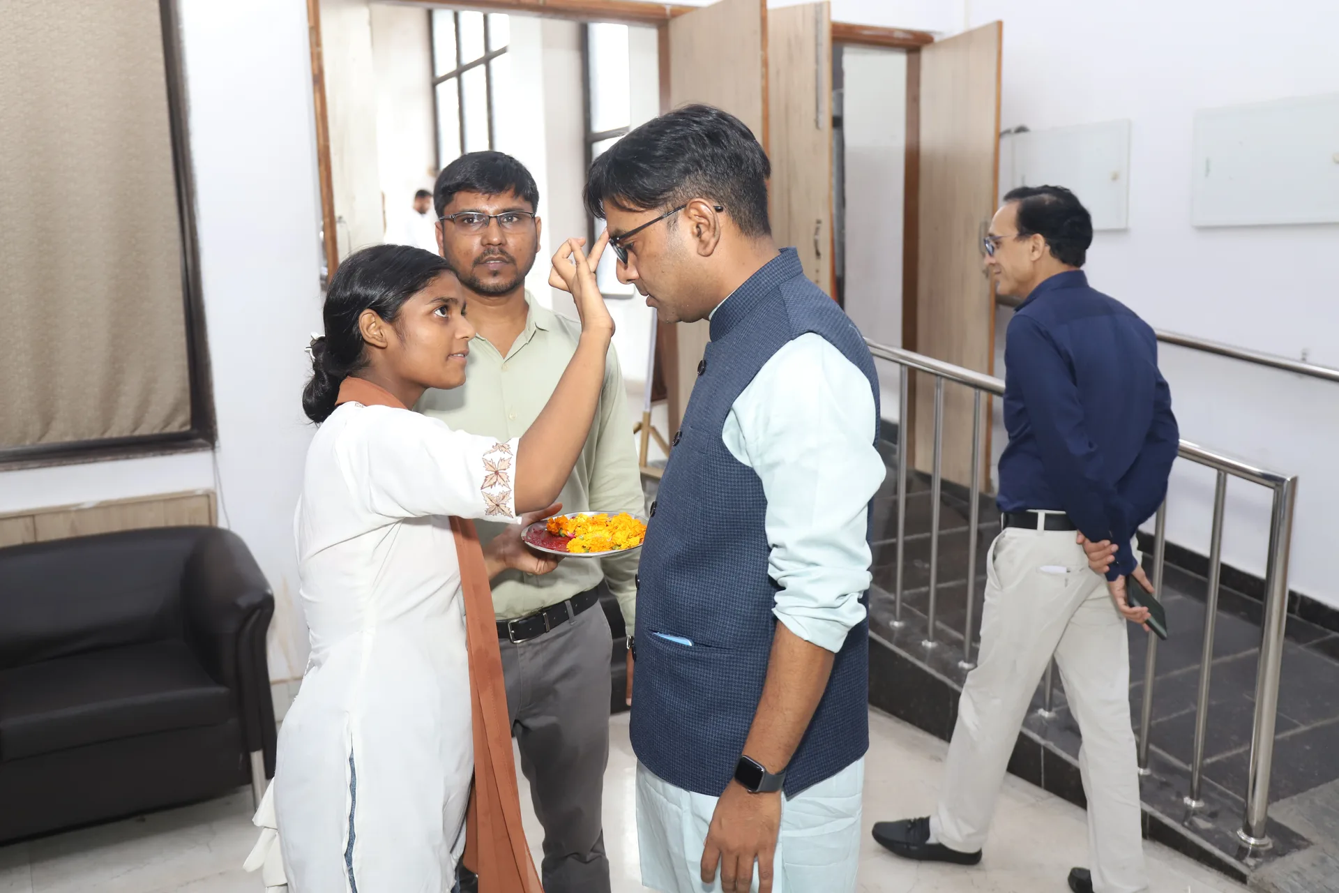 Welcoming guests with tilak